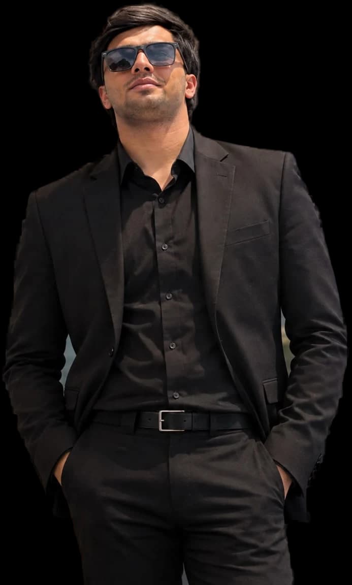 Huzaifa Shahid in a black suit